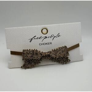 Free People Backstage Pass Beaded Bow Choker in gold | $38